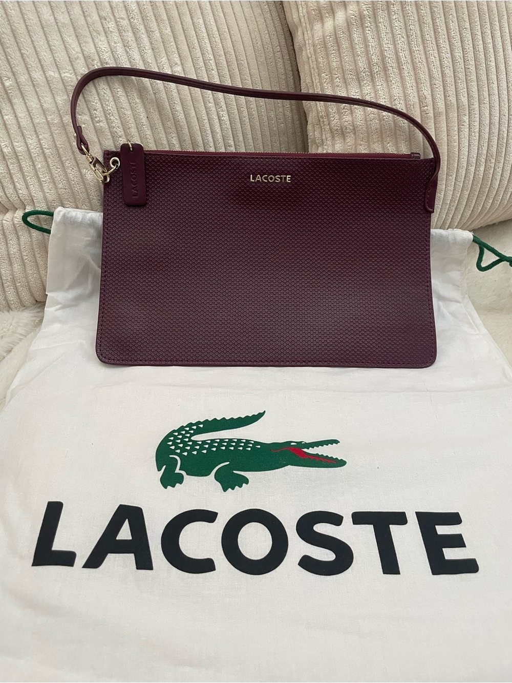 Lacoste  Burgundy Textured Leather Clutch